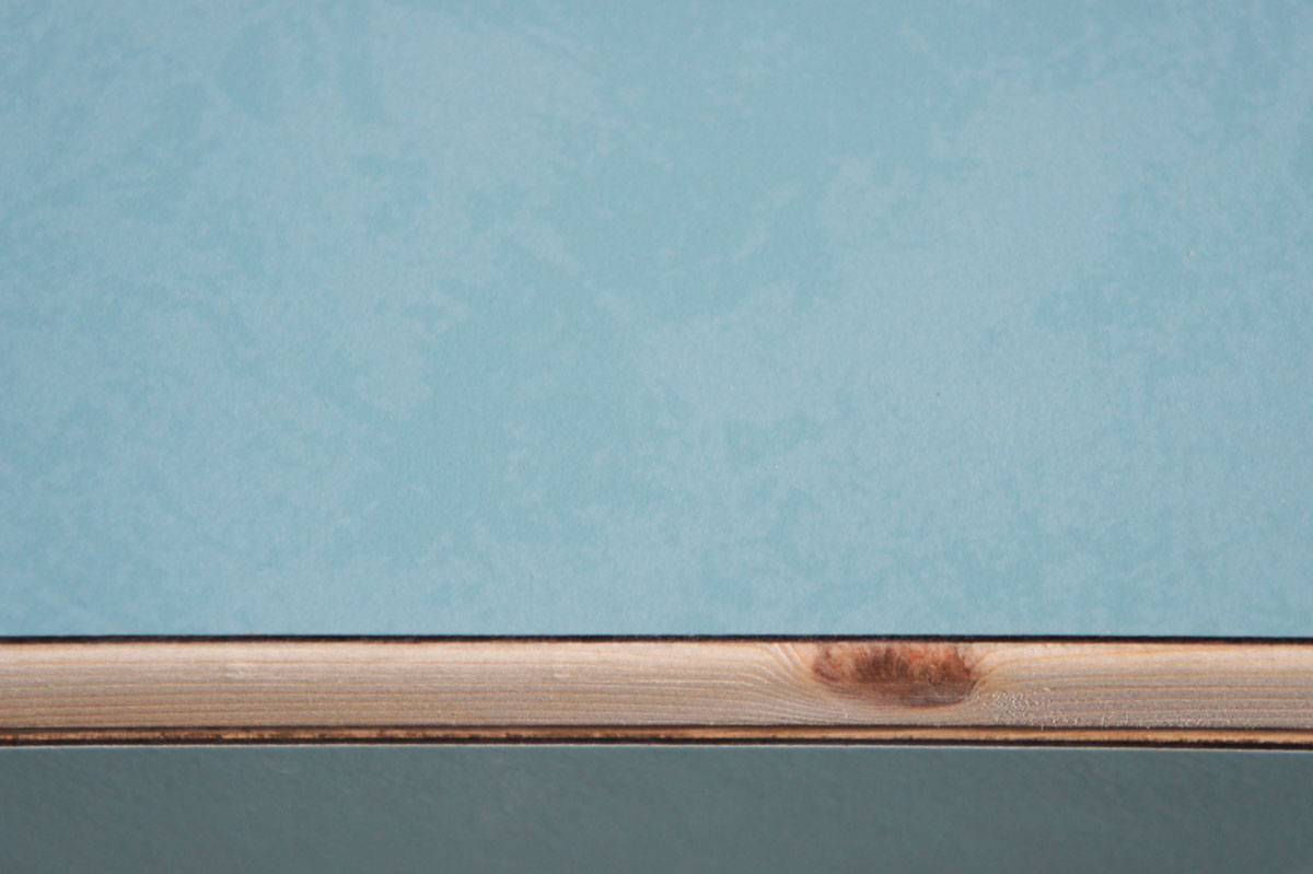 Credenza in mint green and vanilla laminate, pine wood, and OSB with recycled black door knobs by Atelier Antipode