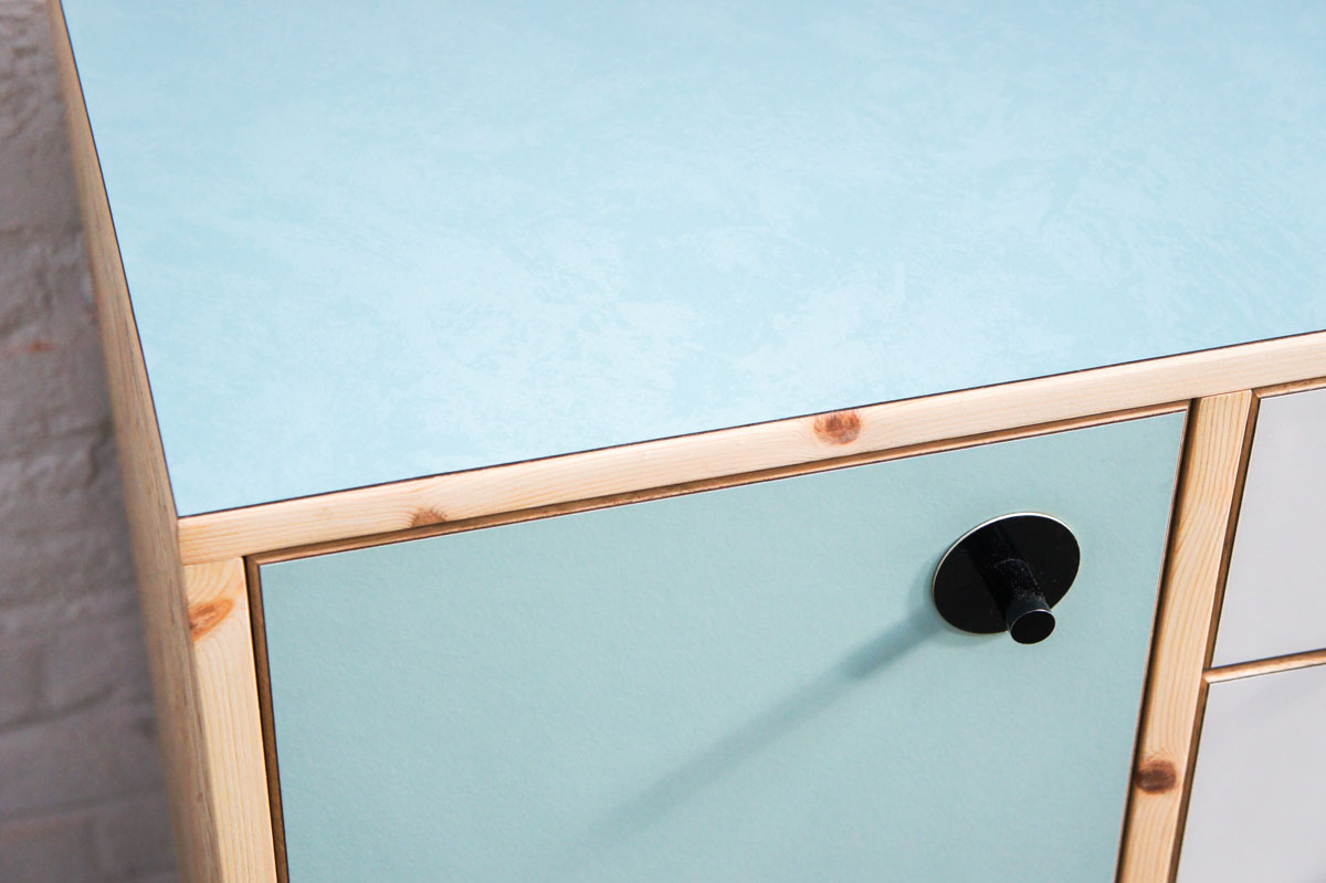 Credenza in mint green and vanilla laminate, pine wood, and OSB with recycled black door knobs by Atelier Antipode