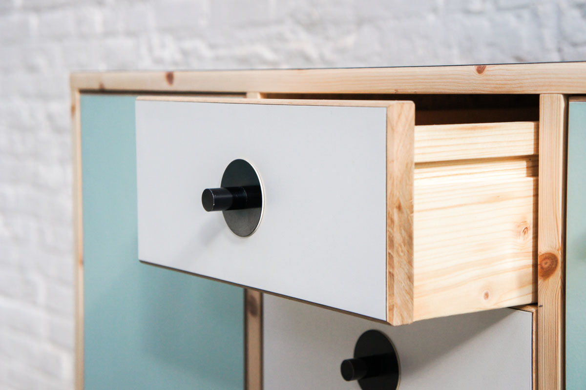 Credenza in mint green and vanilla laminate, pine wood, and OSB with recycled black door knobs by Atelier Antipode