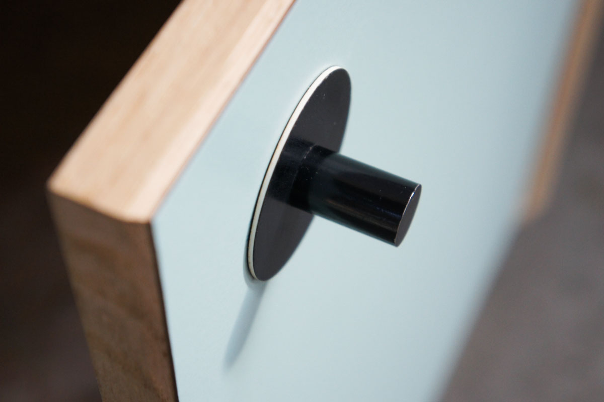 Credenza in mint green and vanilla laminate, pine wood, and OSB with recycled black door knobs by Atelier Antipode