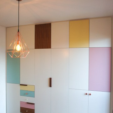 Atelier Antipode | pastel patchwork | wardrobe of white laquered doors matched with pastel laminate and oak, handmade meranti handles and copper cabinet knobs by Schoolhouse Electric