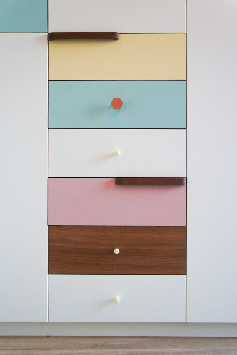 Atelier Antipode | pastel patchwork | wardrobe of white laquered doors matched with pastel laminate and oak, handmade meranti handles and copper cabinet knobs by Schoolhouse Electric
