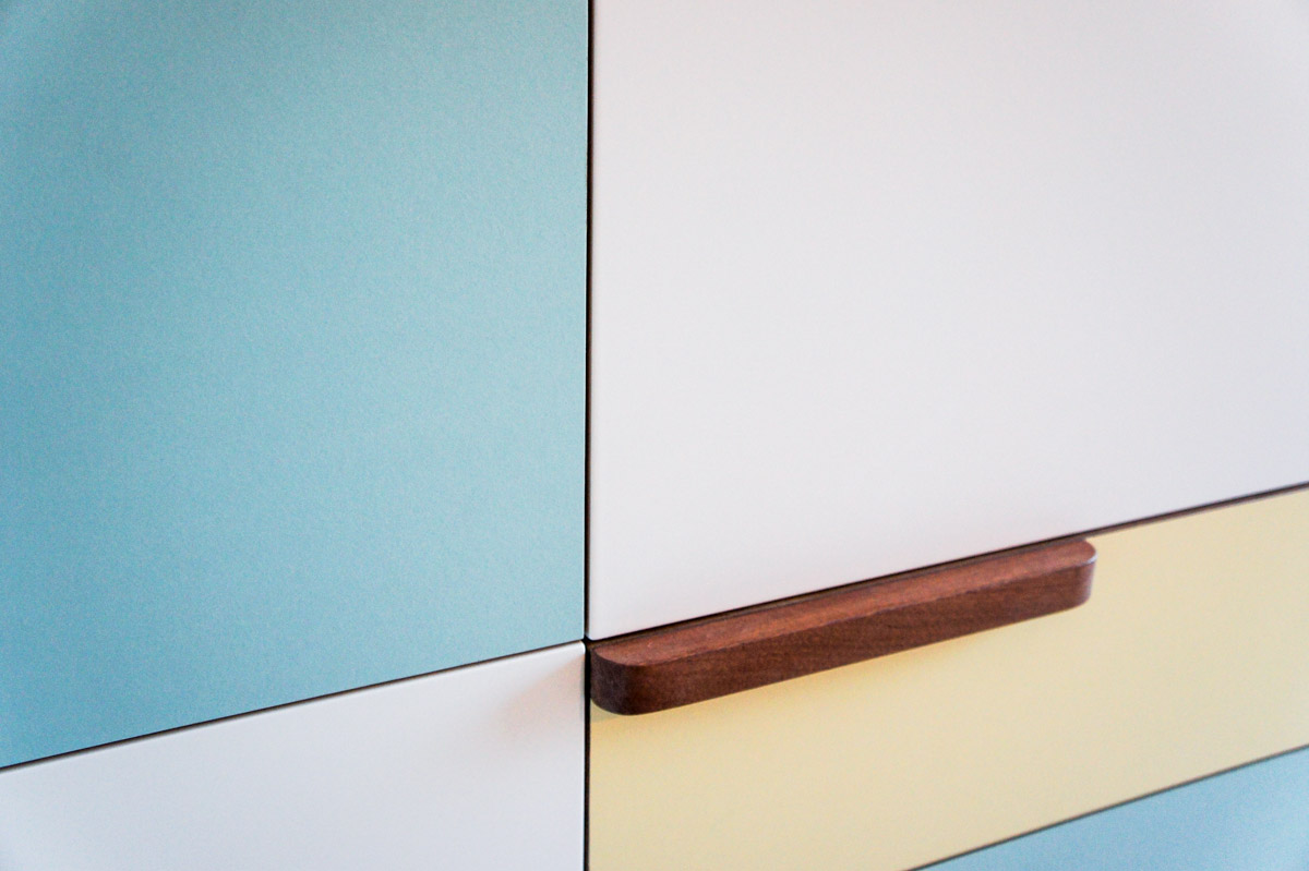 Atelier Antipode | pastel patchwork | wardrobe of white laquered doors matched with pastel laminate and oak, handmade meranti handles and copper cabinet knobs by Schoolhouse Electric