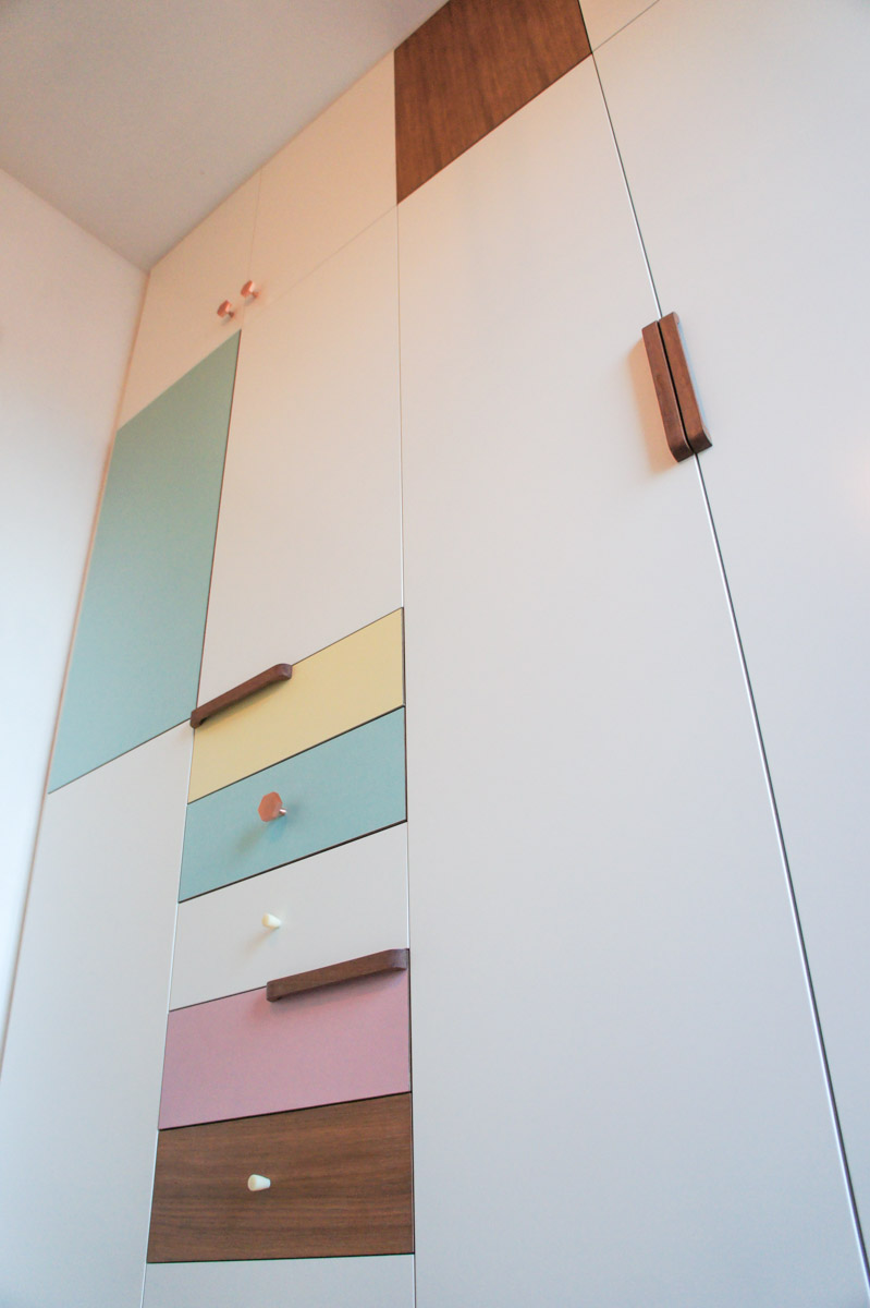 Atelier Antipode | pastel patchwork | wardrobe of white laquered doors matched with pastel laminate and oak, handmade meranti handles and copper cabinet knobs by Schoolhouse Electric